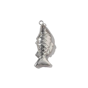 Detailed macro view of silver stainless steel fish pendant with textured scales and fins