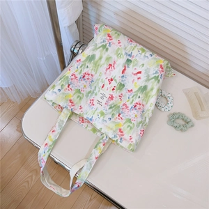 Close-up of floral cotton tote bag showing detailed colorful print and fabric texture