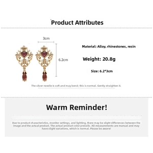 Detailed view of vintage heart earrings with burgundy resin, size 6.2x3cm and 20.8g weight