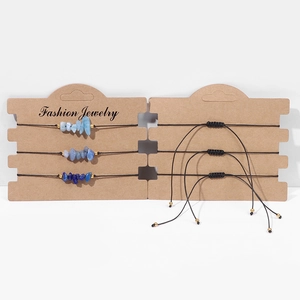 Detailed view of three handmade natural crystal stone bracelets with adjustable cords
