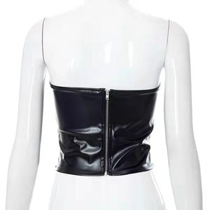 Close-up of black PU leather bandeau top featuring a metallic back zipper detail