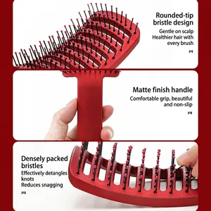 Red curved vented hairbrush with boar bristles and ergonomic matte handle for styling