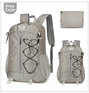Detailed view of grey lightweight nylon outdoor backpack with matching zipper pouch