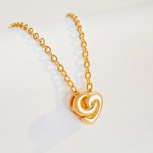 Collier avec pendentif cœur torsadé doré au design en spirale poli et chaîne classique