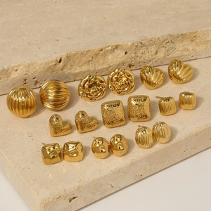 9-pair set of gold stainless steel stud earrings featuring rose, heart, and textured shapes