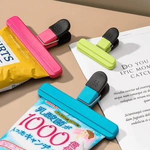 Set of T-shape plastic food sealing clips in pink, green and blue for snack bags