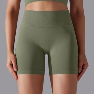 Detail of olive green ribbed high-waisted seamless sports shorts with wide waistband