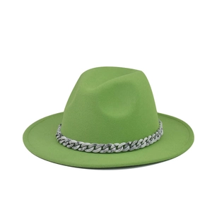 Detail of green fedora hat featuring a marble textured chain link band on flat brim