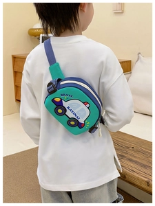 Rear view of a child wearing the car-shaped chest bag in a warm home setting