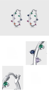 Detailed macro view of S925 sterling silver hoop earrings with hand-set colorful zircons
