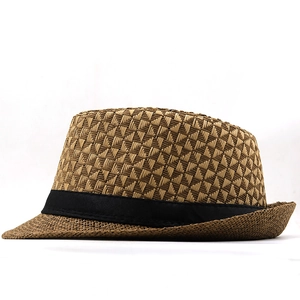 Detail of a brown woven straw fedora hat featuring a stylish black satin ribbon band