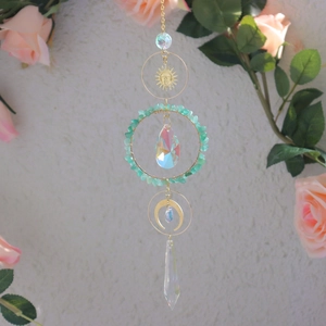 Rainbow sun catcher with green stones, golden moon sun motifs and crystal prisms