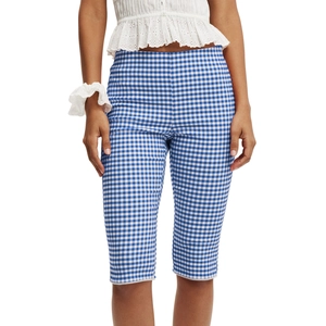 Detail shot of blue and white plaid capri pants featuring delicate white lace trim on the hem