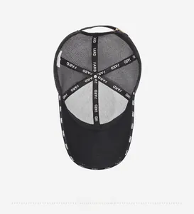 Detail view of breathable black mesh cap interior with FARD branded tape and metal buckle