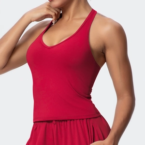 Close-up of red V-neck sports bra and shorts with racerback design in high-stretch fabric