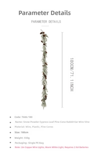 Detail of 180cm frosted pine cone garland with snow powder leaves and warm white LED lights