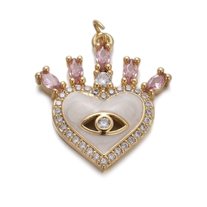 Detail of gold crown heart pendant with pink crystals and evil eye enamel design