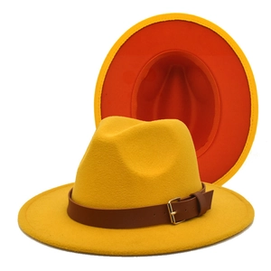 Detail of wide brim fedora hats with leather belt strap and two-tone contrast design