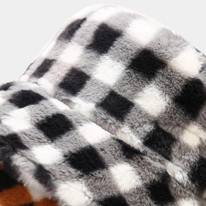 Furry checkerboard bucket hat with plush texture and leopard print brim detail