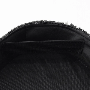 Detail view of black sequin hat lining with adjustable elastic band for secure fit
