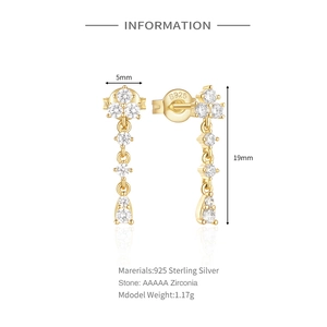 Detail of 925 sterling silver gold fringe earrings with AAAAA cubic zirconia stones