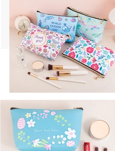 Detailed view of printed waterproof PU makeup bags featuring floral and ocean themes