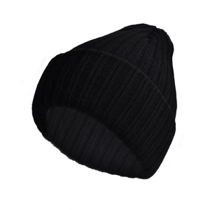 Close-up of the thick rib-knit texture and soft black fabric on the winter beanie