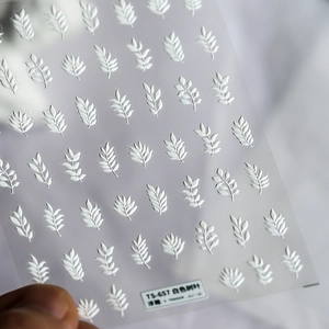 White embossed leaf nail stickers TS-657 with 3D texture on frosted adhesive backing