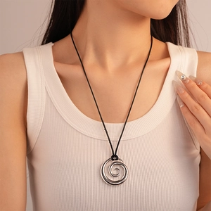Minimalist silver metal spiral pendant necklace with black cord for modern women fashion
