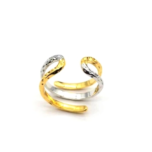 Macro view of wave-shaped S925 silver ring with hammered texture and two-tone finish