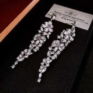 Luxurious flower drop earrings with long tassels and sparkling cubic zirconia stones