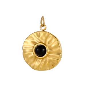 Detailed view of gold stainless steel pendant with hammered texture and black inlay