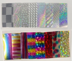Detailed view of holographic glitter swatches showing rainbow patterns and textures
