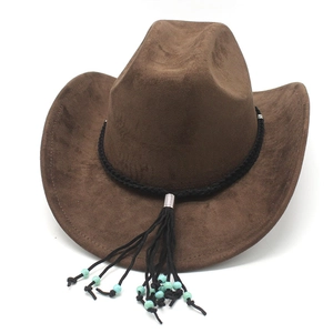Detail of dark brown faux suede western cowboy hat with turquoise bead and tassel