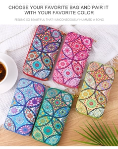 Close-up of long wallets with retro mandala patterns in blue, red, pink, green, and yellow