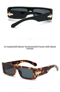 Detailed view of rectangular sunglasses in black and tortoiseshell with gold arrow accents