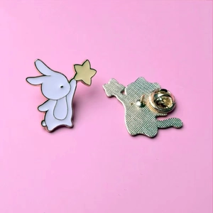 Cute white bunny enamel pin holding a yellow star, Japanese style cartoon badge for clothes