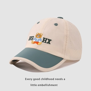 Detail of kid's mesh baseball cap showing bear embroidery and breathable air holes