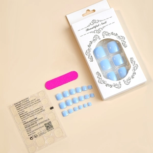Light blue press-on toe nail kit including 24 pieces, jelly glue tabs and a nail file