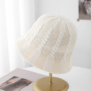 Detailed close-up of cable-knit texture on beige breathable summer bucket sun hat