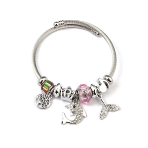 Detail of silver cable bracelet with tree of life, crown and pink crystal charms