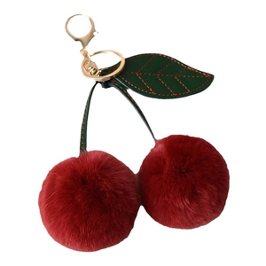 Cute faux rabbit fur cherry keychain with red plush balls and green leather leaf detail