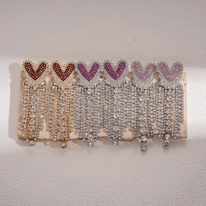 Elegant heart-shaped tassel earrings with rhinestones in gold and silver finish