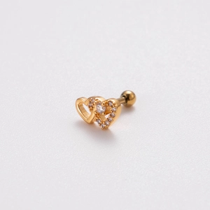 Macro shot of gold double heart stud earring with cubic zirconia and screw ball back