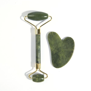 Natural jade facial roller and heart-shaped gua sha tool set with golden metal connectors