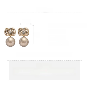 Detail view of gold-tone earrings with dimensions and technical specifications listed
