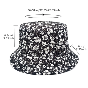 Floral reversible bucket hat in black with white flowers and size measurements