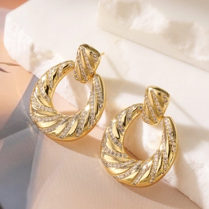 Luxurious 18K gold-plated twisted hoop earrings with shimmering cubic zirconia gemstones