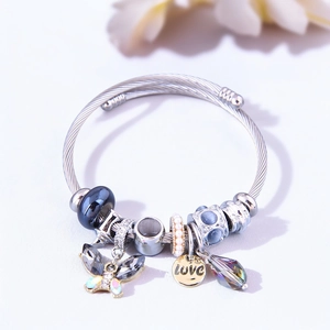 Detail of stainless steel charm bracelet with crystal butterfly and LOVE tag