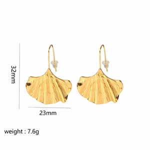 Golden ginkgo leaf earrings with 32mm height and 23mm width showing detailed metal texture